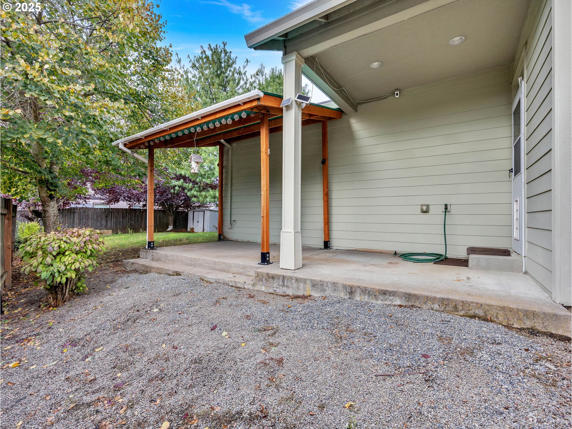 3279 Southeast Anderson Road Gresham, OR 97080 - Photo 32 of 42 a view of a house with a backyard and porch