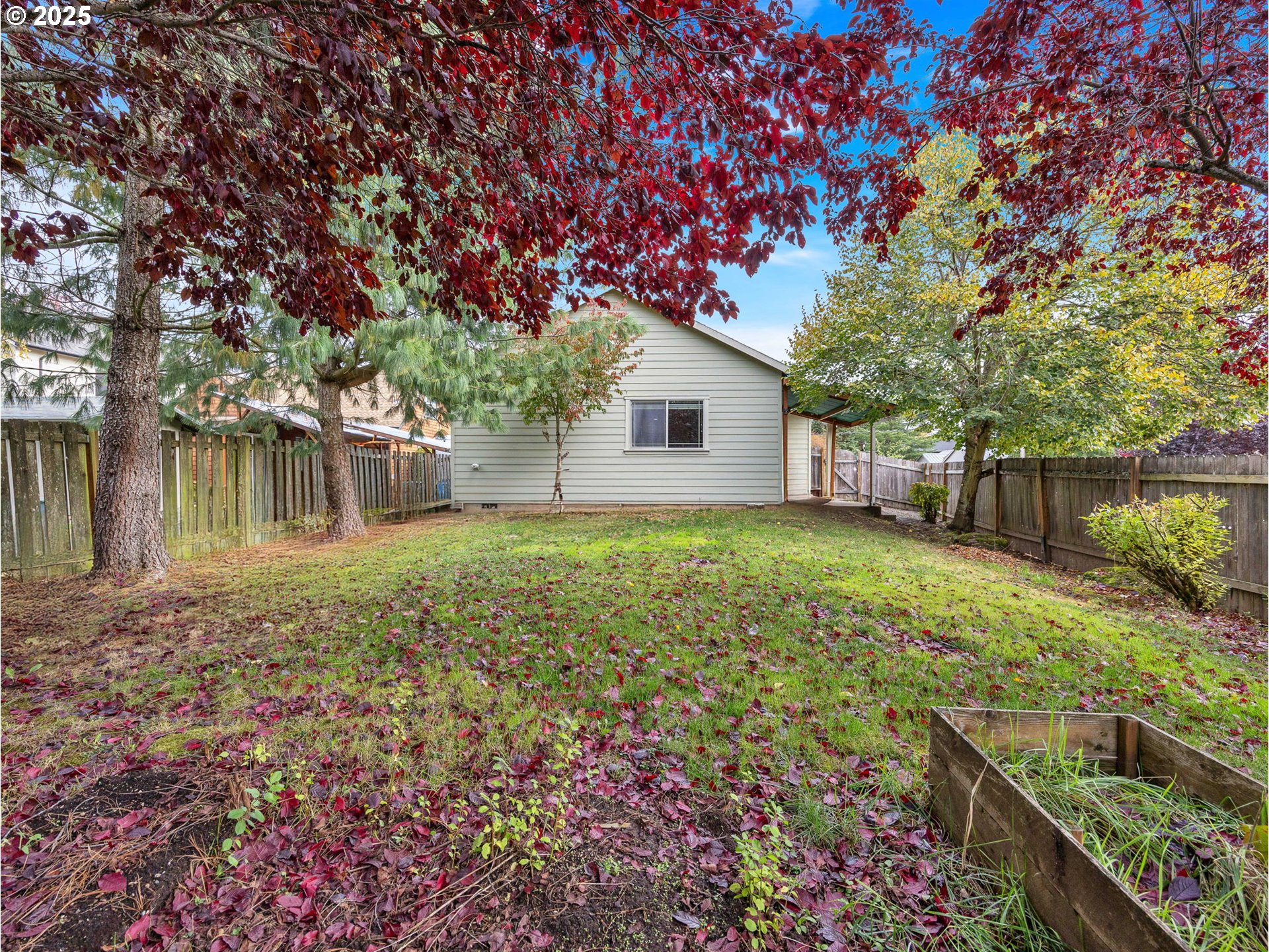 3279 Southeast Anderson Road Gresham, OR 97080 - Photo 37 of 42 a backyard of a house with lots of green space and garden