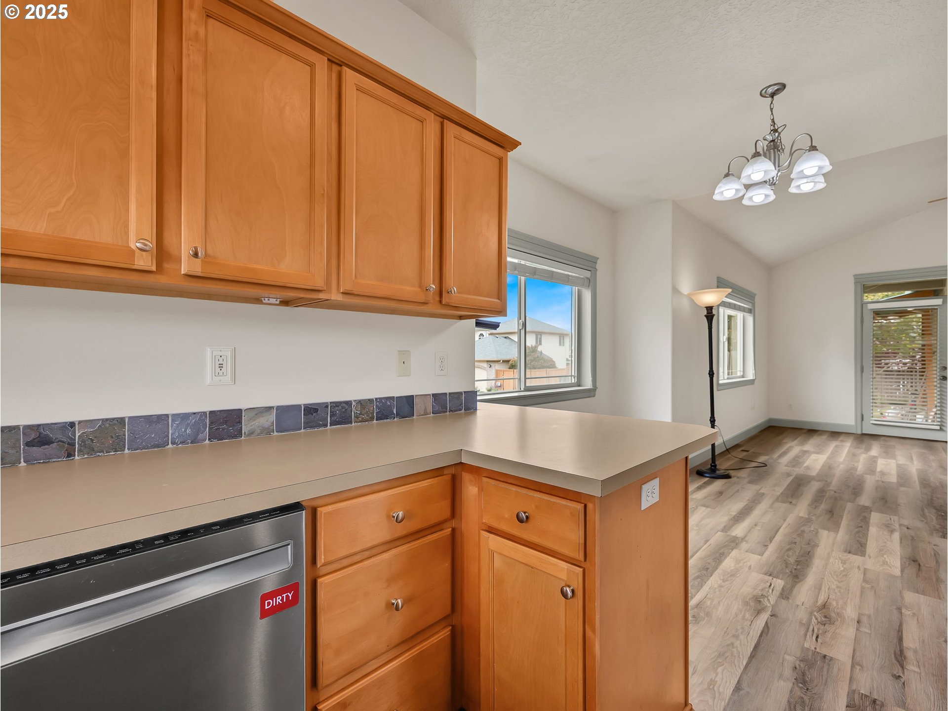 3279 Southeast Anderson Road Gresham, OR 97080 - Photo 7 of 42 a kitchen with a sink window and cabinets