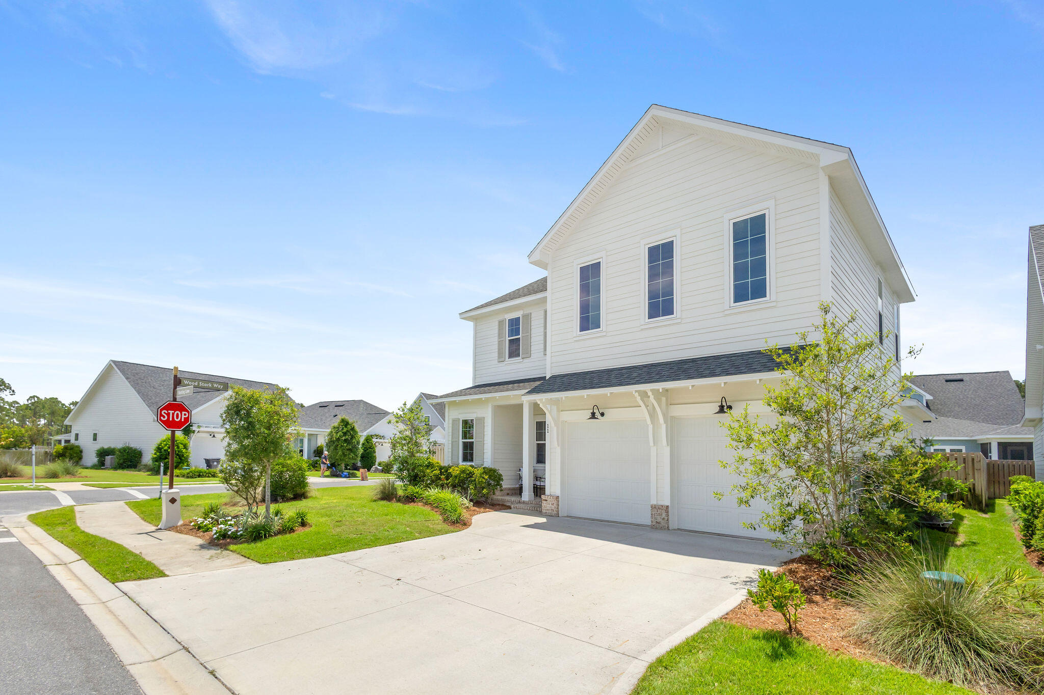 11 Bunting Ln Inlet Beach Inlet Beach, FL 32461 - Photo 50 of 70 a front view of a house with a yard and potted plants