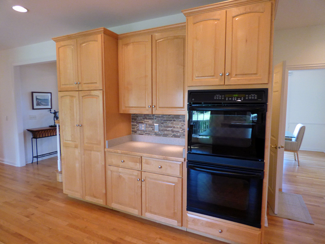 S130 Forbes Drive Geneva, IL 60134 - Photo 13 of 45 a kitchen with granite countertop white cabinets and stainless steel appliances