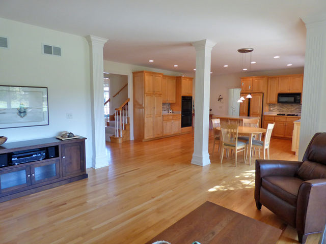 S130 Forbes Drive Geneva, IL 60134 - Photo 18 of 45 a living room with furniture and a wooden floor