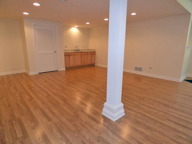 S130 Forbes Drive Geneva, IL 60134 - Photo 33 of 45 a view of empty room with wooden floor