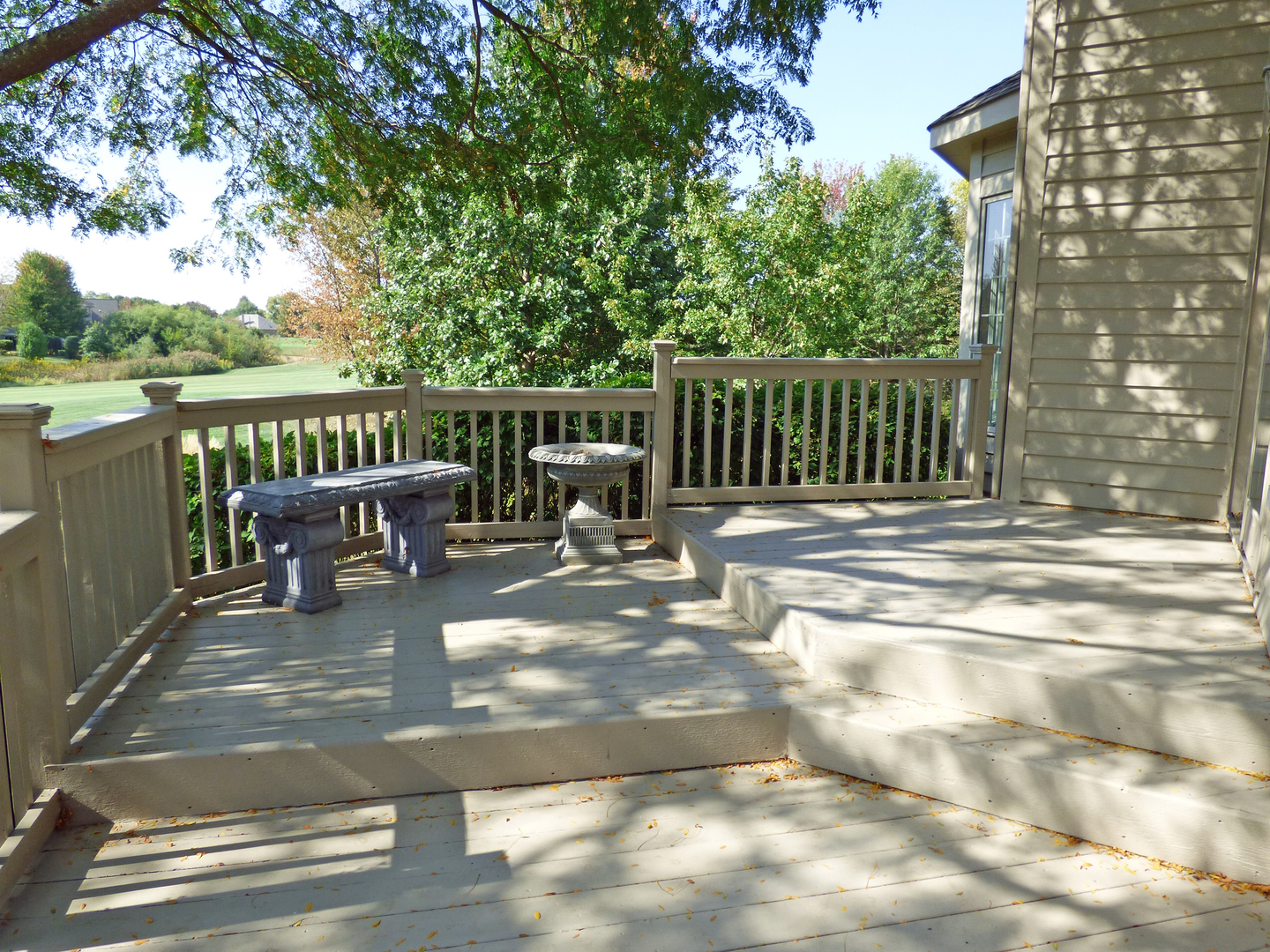 S130 Forbes Drive Geneva, IL 60134 - Photo 40 of 45 a view of a chairs and table on the wooden deck