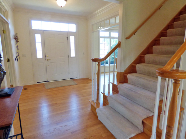 S130 Forbes Drive Geneva, IL 60134 - Photo 5 of 45 a view of entryway and hall with wooden floor