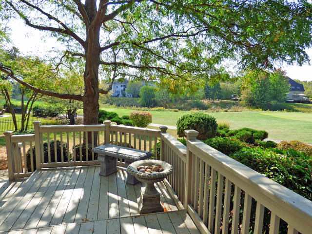 S130 Forbes Drive Geneva, IL 60134 - Photo 41 of 45 a view of a deck with two chair and wooden floor