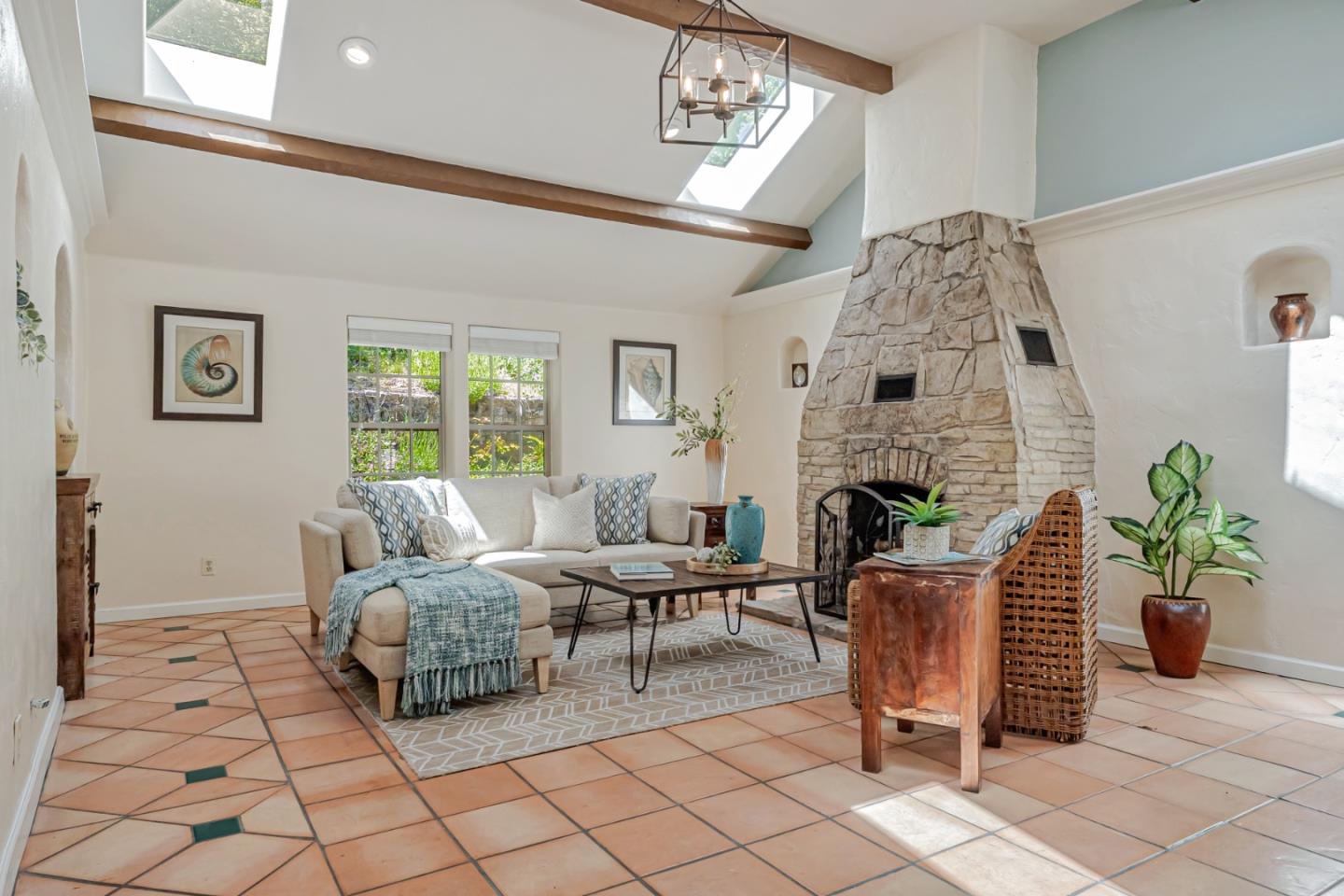 361 Moosehead Drive Aptos, CA 95003 - Photo 7 of 37 a living room with furniture a chandelier and a fireplace