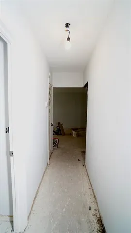 a white toilet sitting next to a shower curtain