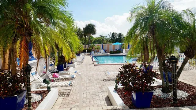a view of backyard with patio and outdoor seating