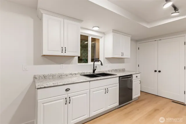 a kitchen with a sink stove and refrigerator