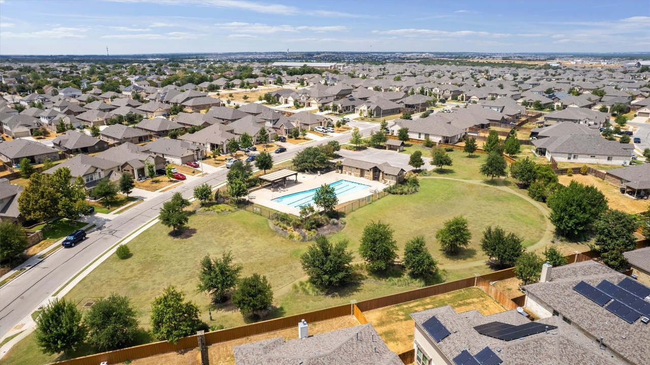 533 Jess Maynard Trail Leander, TX 78641 - Photo 24 of 24 Aerial perspective of suburban area with a pool