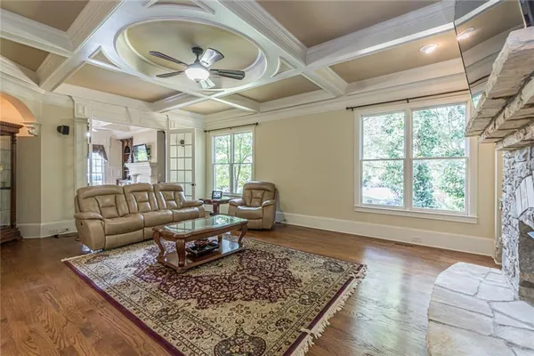 a view of a dining room with furniture wooden floor and chandelier