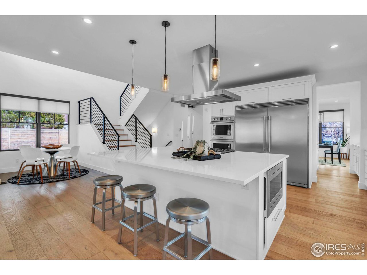 1415 Riverside Avenue Boulder, CO 80304 - Photo 9 of 40 Chef's Kitchen w/ Huge Island w/ Breakfast Bar and Dining Nook Beyond