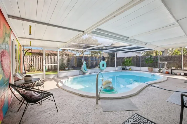 a view of a swimming pool with a patio