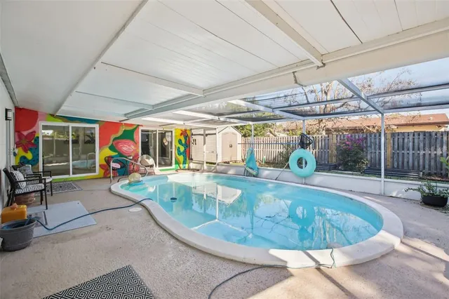 a view of a swimming pool with a patio