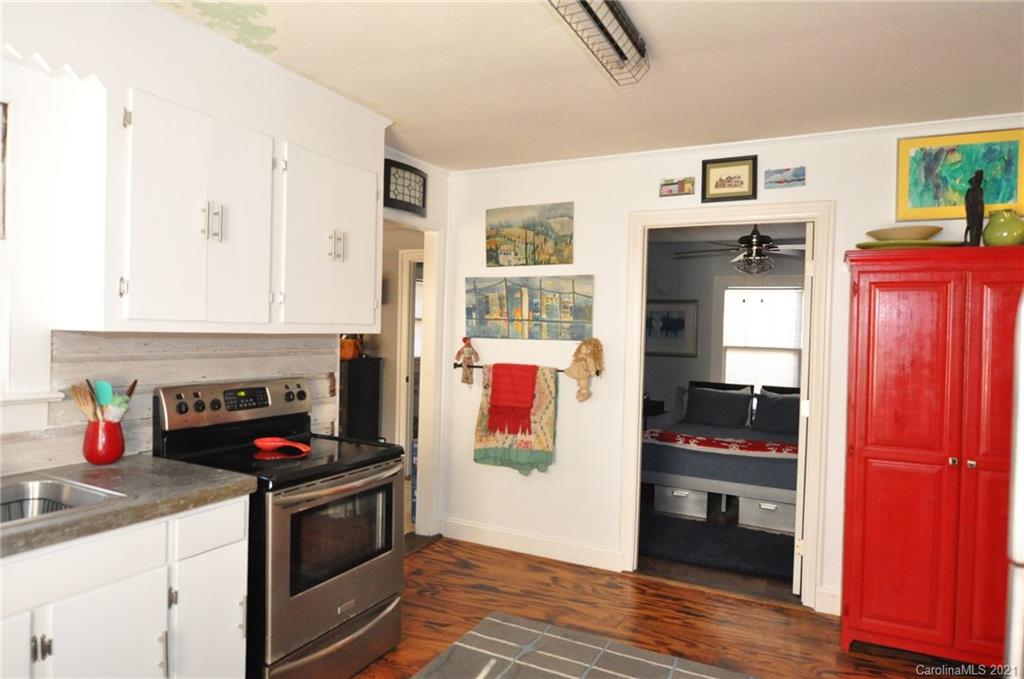 106 Nella Street Chester, SC 29706 - Photo 6 of 13 a kitchen with stainless steel appliances granite countertop a stove and a refrigerator