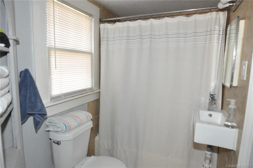 106 Nella Street Chester, SC 29706 - Photo 8 of 13 a bathroom with a sink toilet and shower
