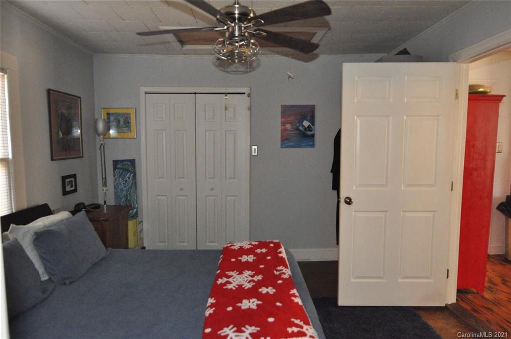 106 Nella Street Chester, SC 29706 - Photo 10 of 13 a bedroom with a bed and a chandelier