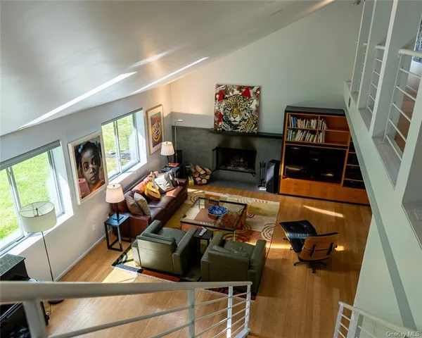 a bedroom with furniture and a fireplace