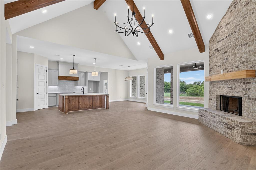 471 Red Bird Drive Springtown, TX 76082 - Photo 9 of 35 Vaulted ceiling with exposed wood beams