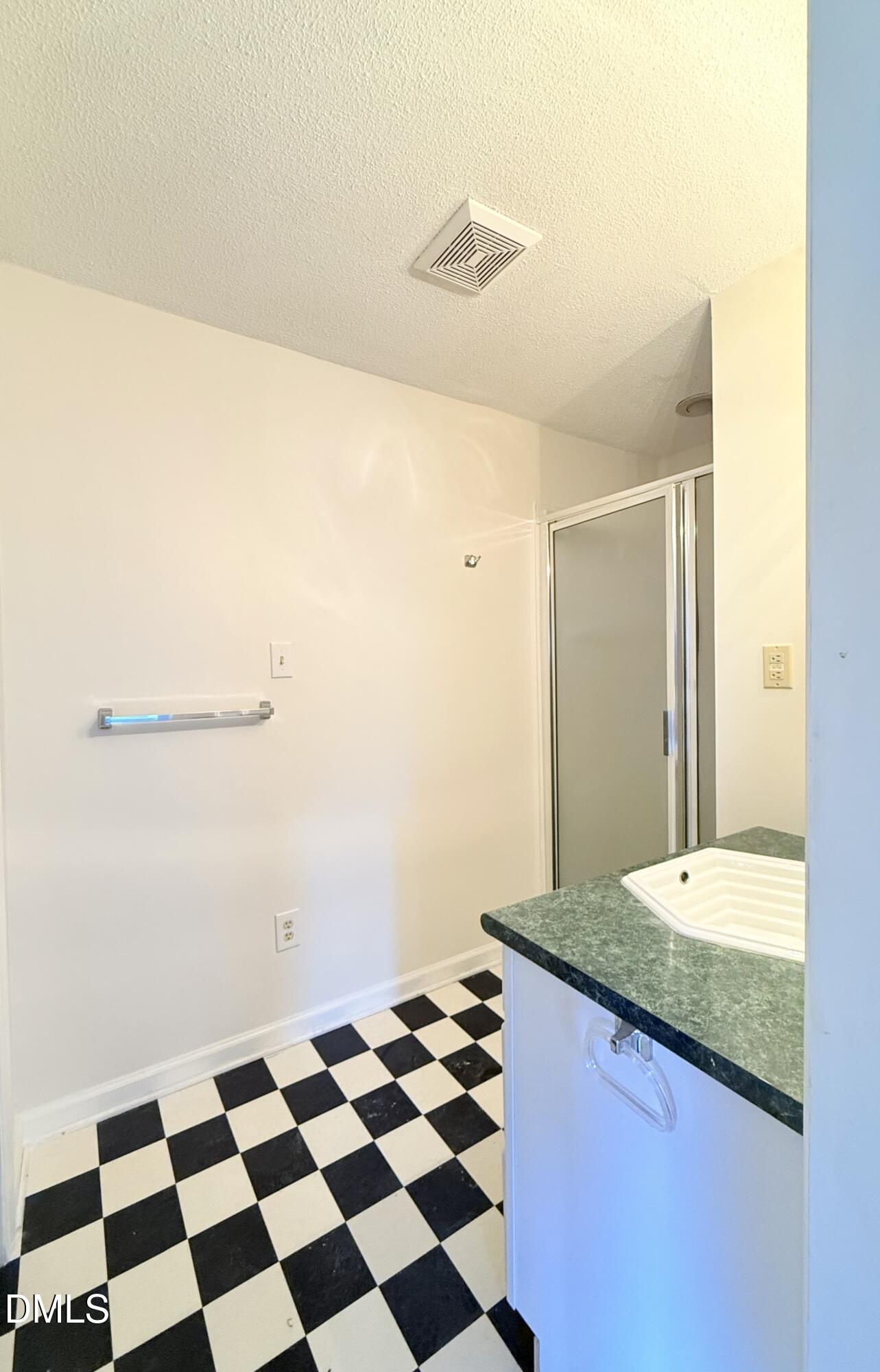 3610 Long Ridge Road Durham, NC 27703 - Photo 19 of 21 a bathroom with a granite countertop sink and mirror