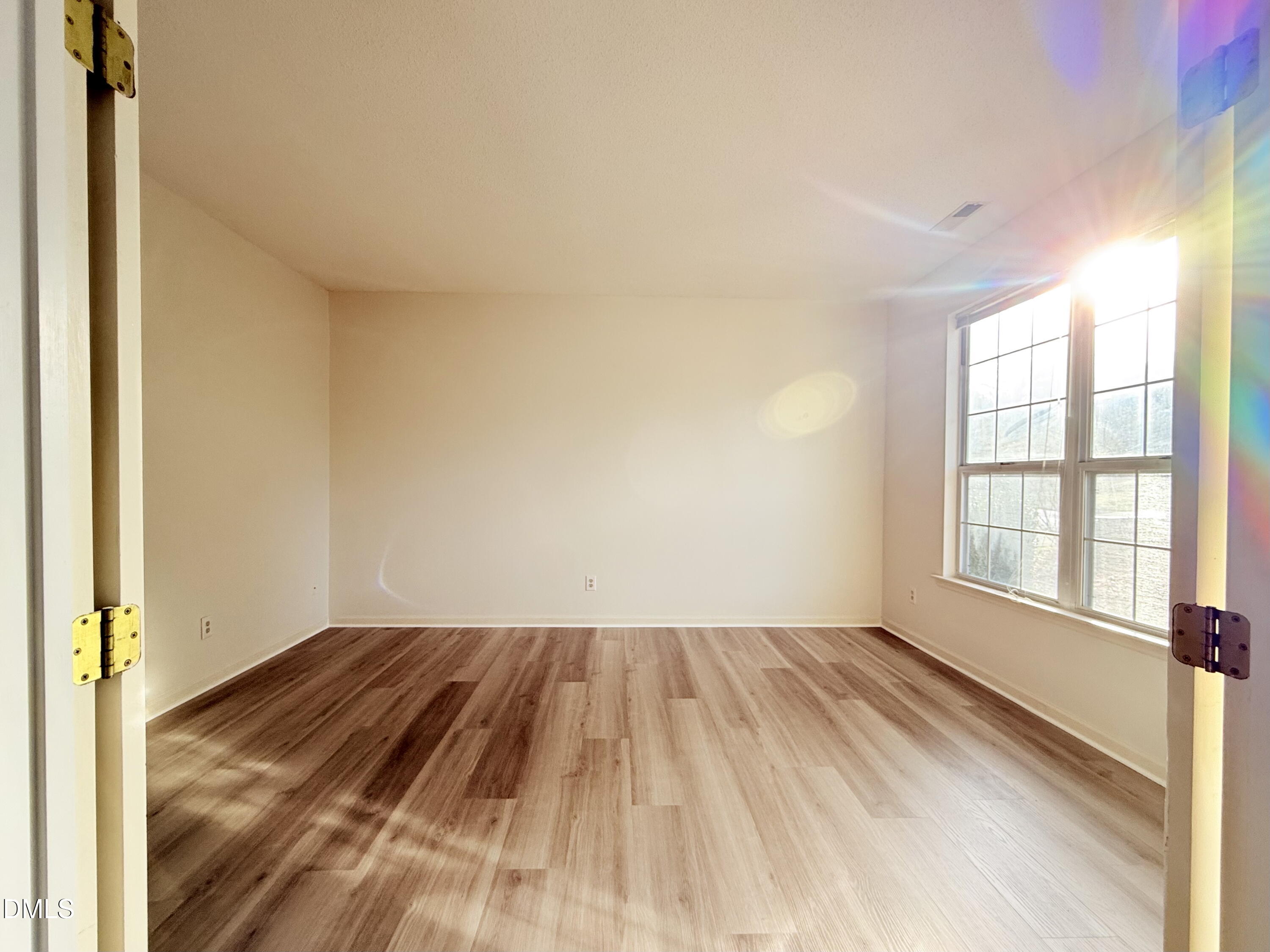 3610 Long Ridge Road Durham, NC 27703 - Photo 2 of 21 wooden floor in an empty room with a window