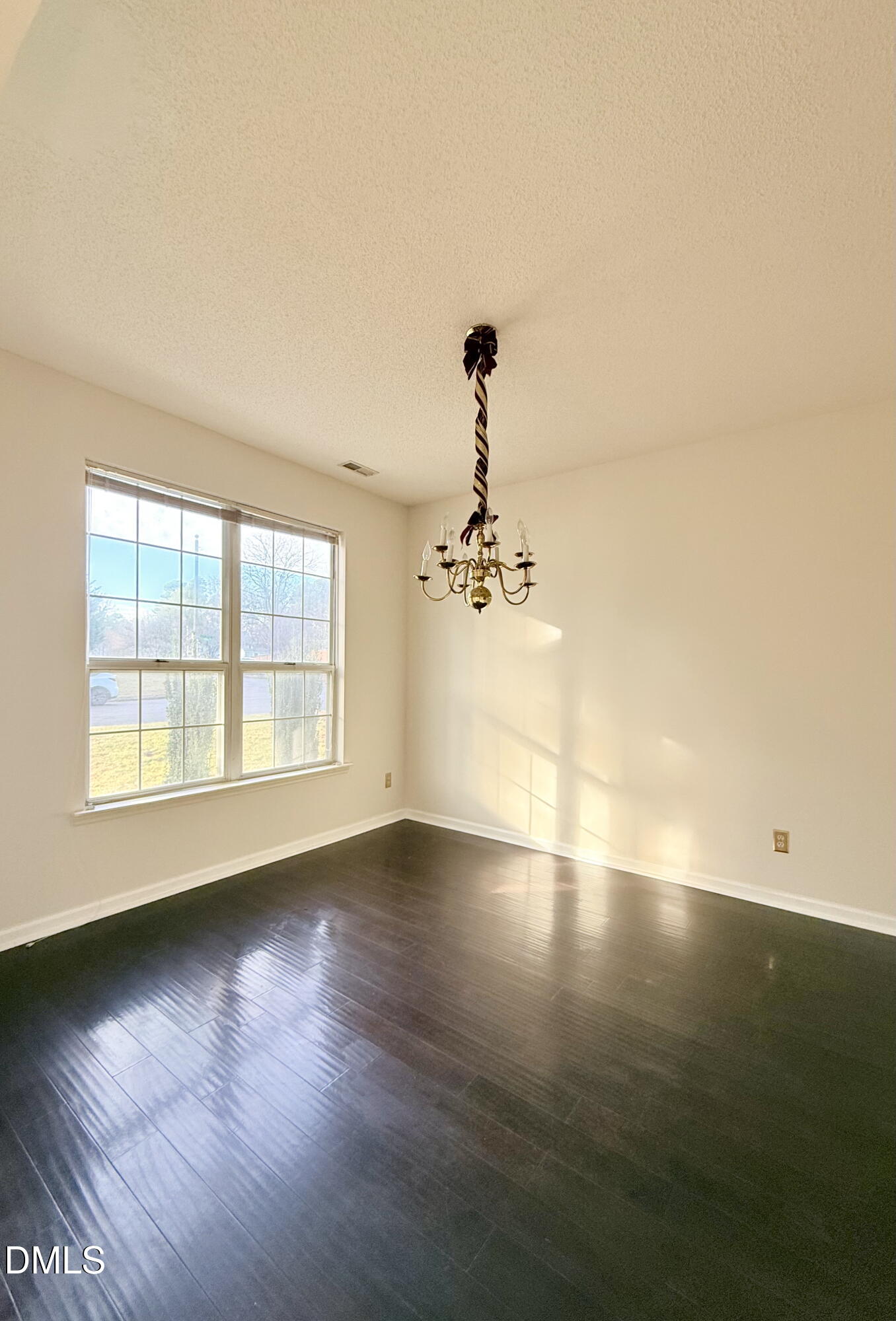 3610 Long Ridge Road Durham, NC 27703 - Photo 5 of 21 a view of empty room with wooden floor and fan