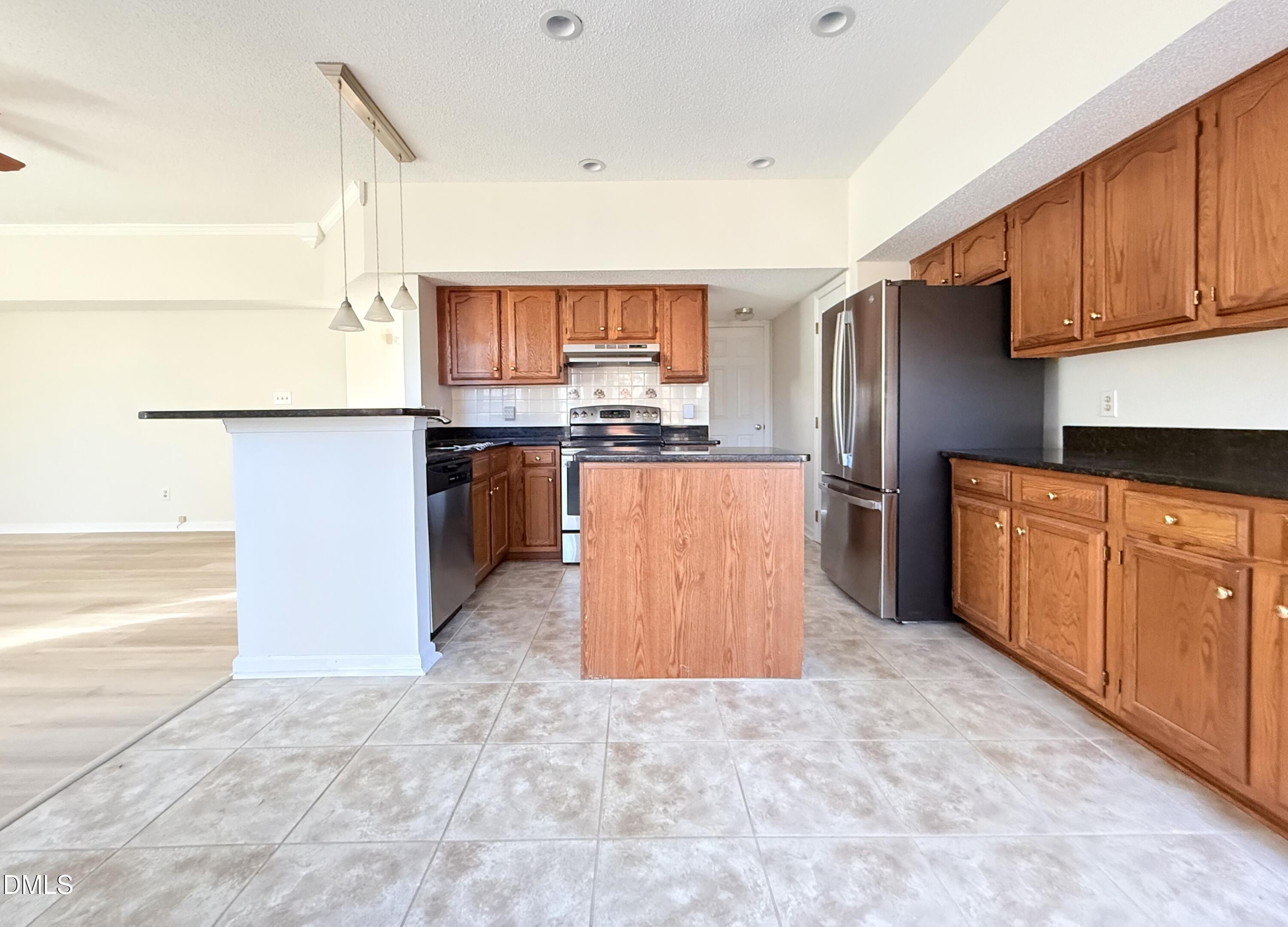 3610 Long Ridge Road Durham, NC 27703 - Photo 8 of 21 a kitchen with stainless steel appliances granite countertop a refrigerator and a stove top oven