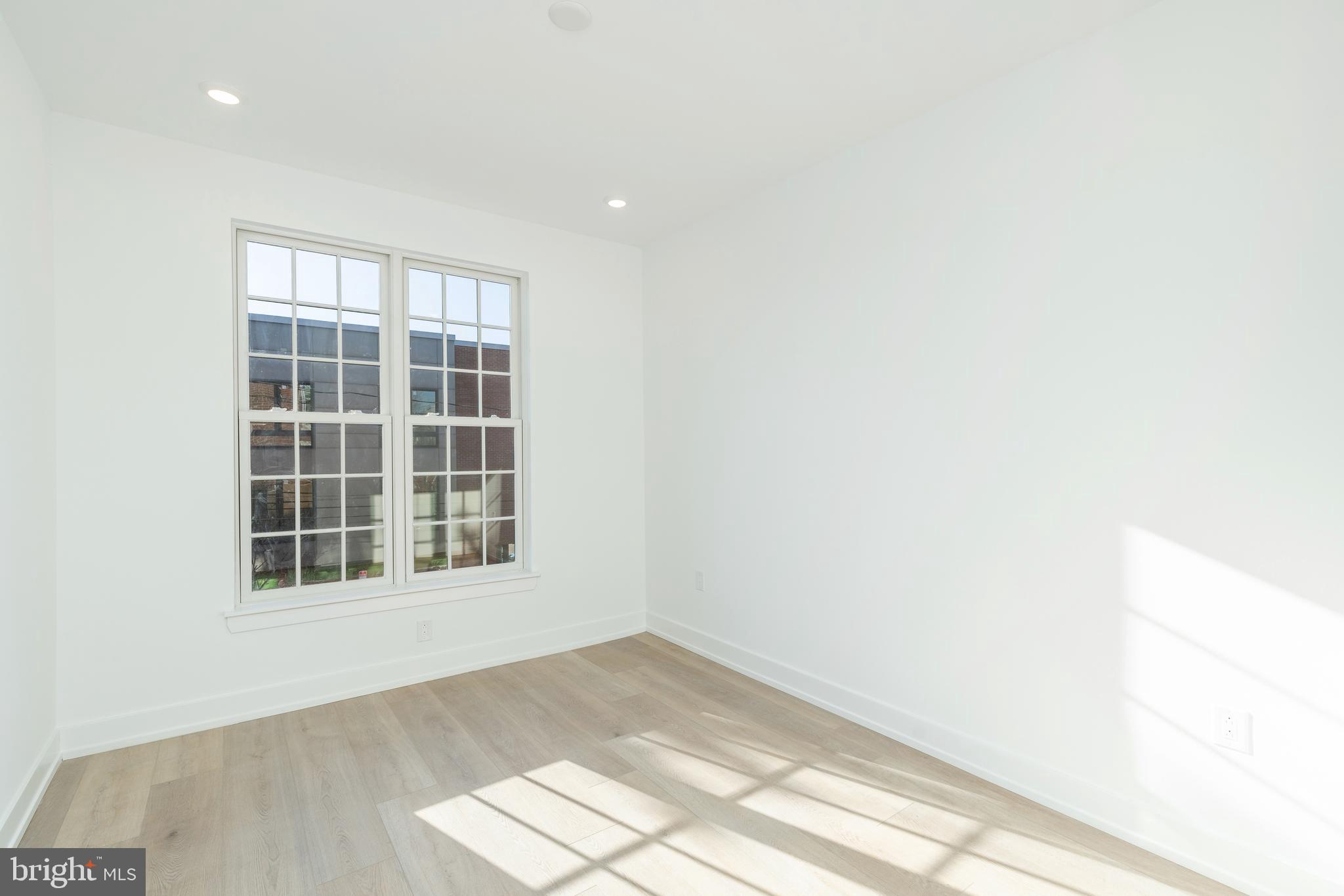 2002 Frankford Avenue, Unit 2F Philadelphia, PA 19125 - Photo 8 of 20 a view of empty room with windows