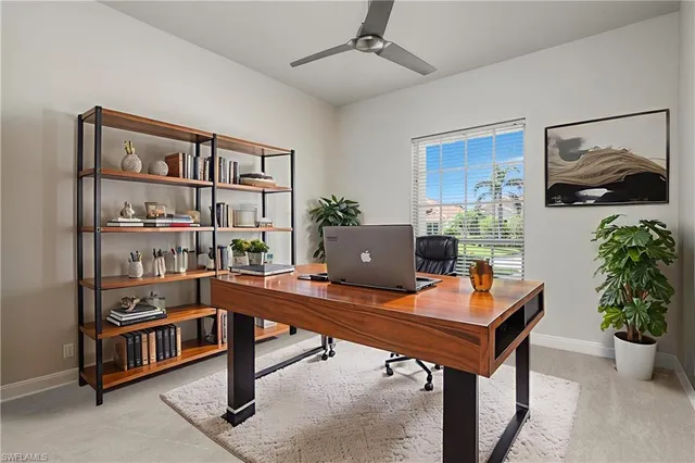 a view of a workspace with furniture