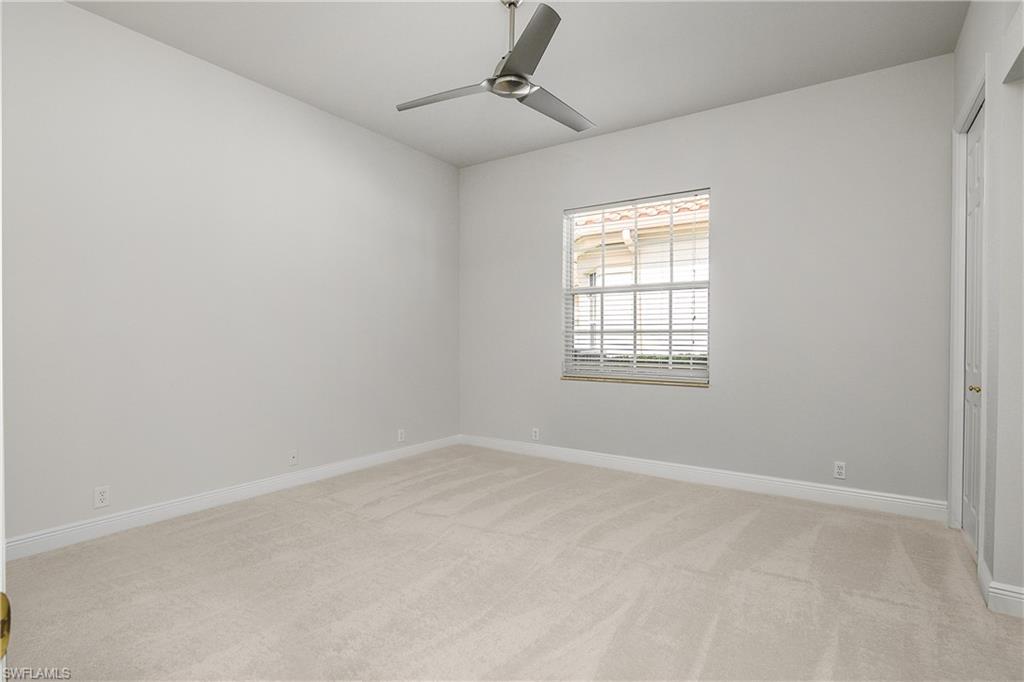 10160 Ginger Pointe Court Estero, FL 34135 - Photo 25 of 37 an empty room with windows