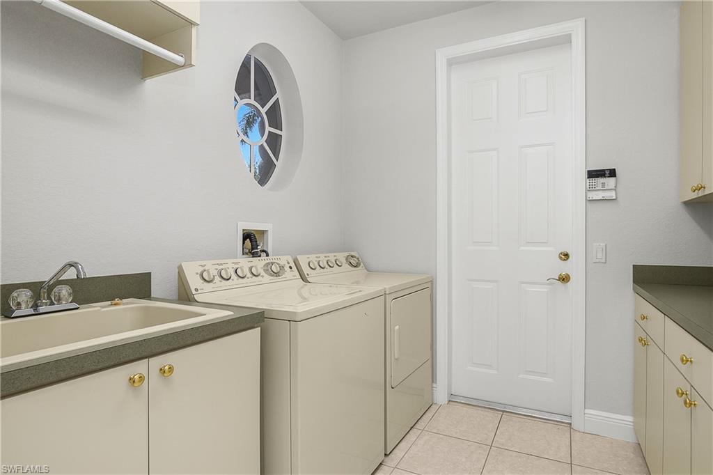 10160 Ginger Pointe Court Estero, FL 34135 - Photo 29 of 37 a utility room with dryer and washer