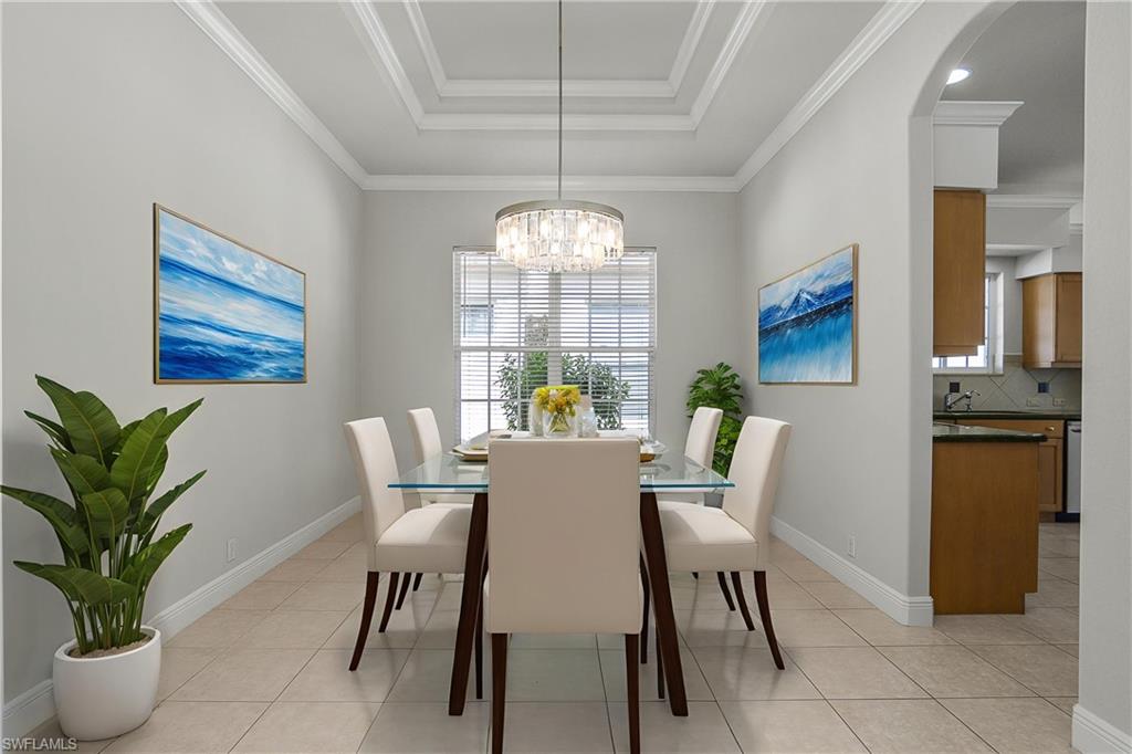 10160 Ginger Pointe Court Estero, FL 34135 - Photo 9 of 37 a view of a dining room with furniture window and wooden floor
