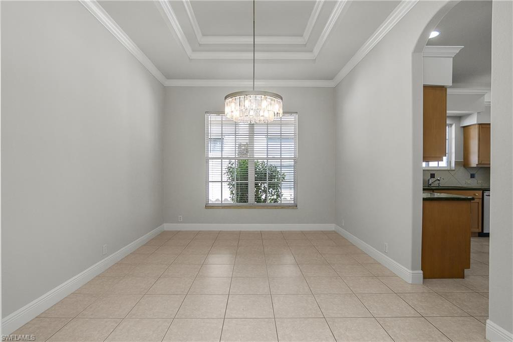 10160 Ginger Pointe Court Estero, FL 34135 - Photo 10 of 37 an empty room with windows and entrance