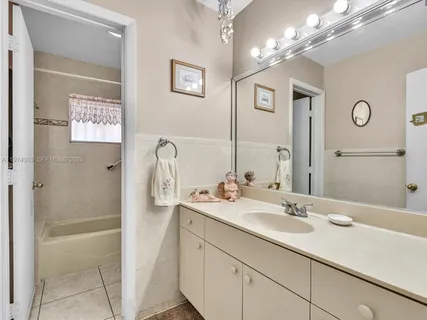 a bathroom with a sink double vanity and shower