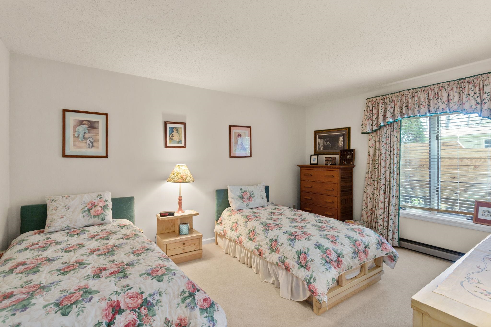 13004 Indian Trail Road Broadway, VA 22815 - Photo 34 of 56 a bedroom with two beds and a dresser with large mirror