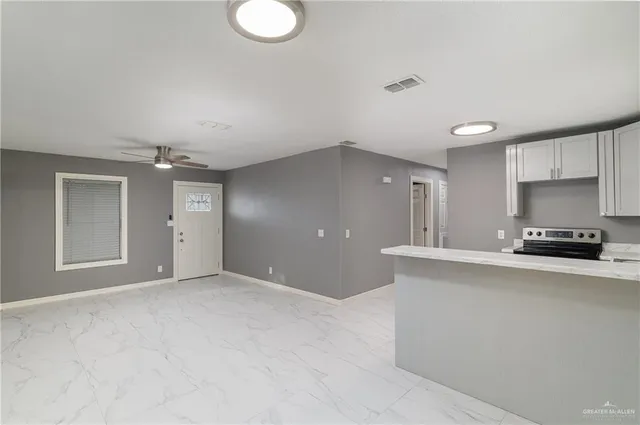 a view of a kitchen with a sink and a window