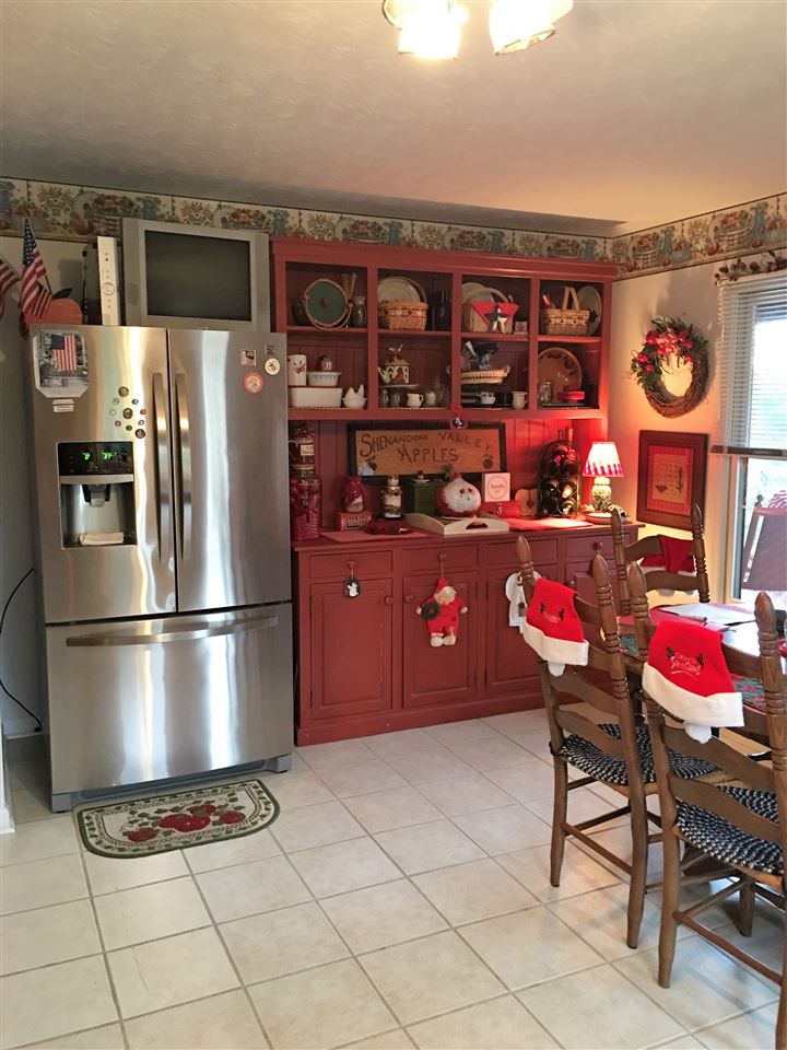 96 Swoope Road Swoope, VA 24479 - Photo 18 of 27 a kitchen with stainless steel appliances granite countertop a refrigerator sink and cabinets