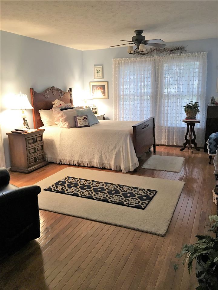 96 Swoope Road Swoope, VA 24479 - Photo 21 of 27 a bedroom with a bed and wooden floor
