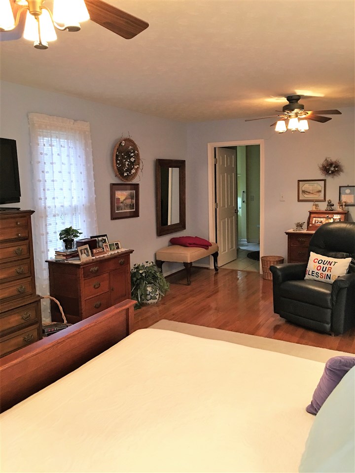 96 Swoope Road Swoope, VA 24479 - Photo 22 of 27 a living room with furniture a chandelier and a flat screen tv