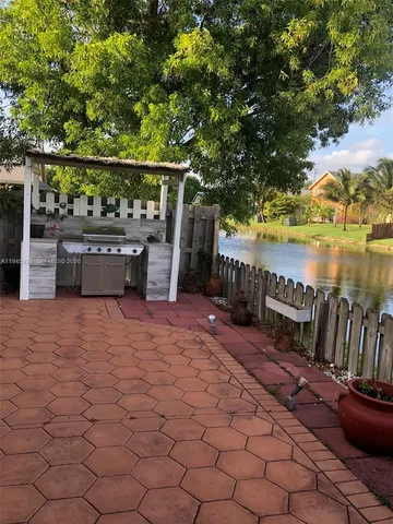 a view of swimming pool with seating space