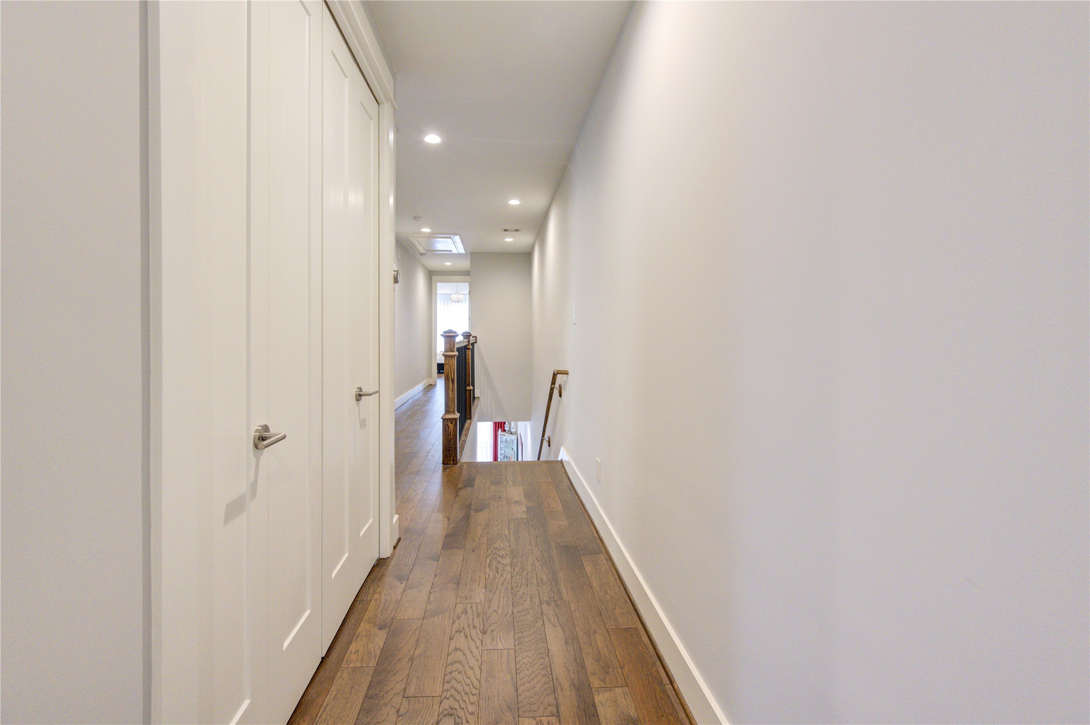 419 Malone Street Houston, TX 77007 - Photo 37 of 47 The home features wide hallways and elegant engineered hardwood flooring throughout