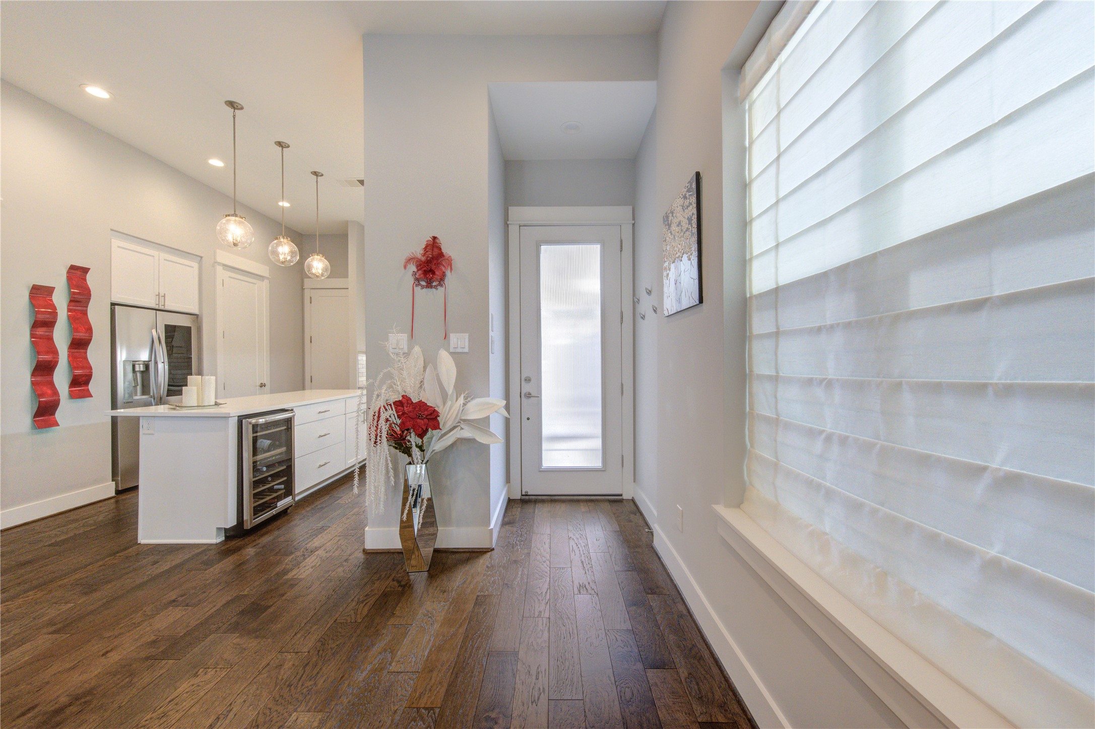 419 Malone Street Houston, TX 77007 - Photo 4 of 47 The entrance showcases custom-designed curtains tailored to the space.