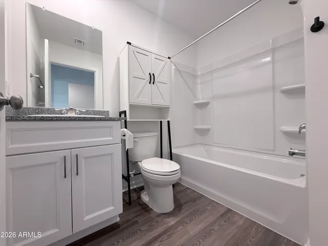 a bathroom with a sink a toilet and a bathtub