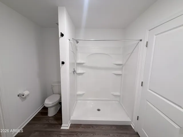 a bathroom with a glass shower door