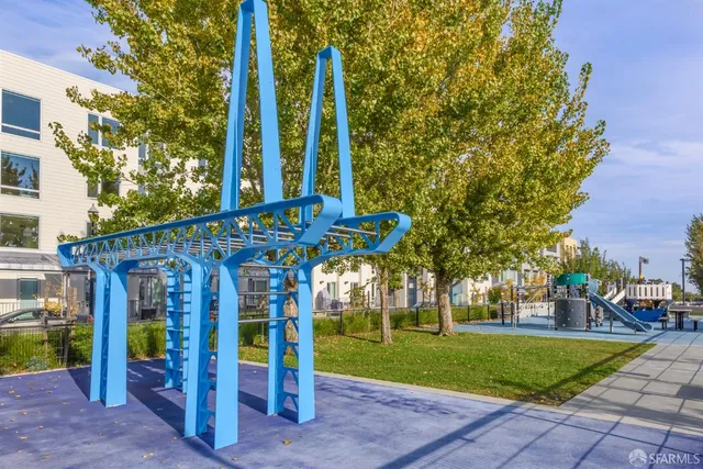 a view of outdoor kitchen with a sink