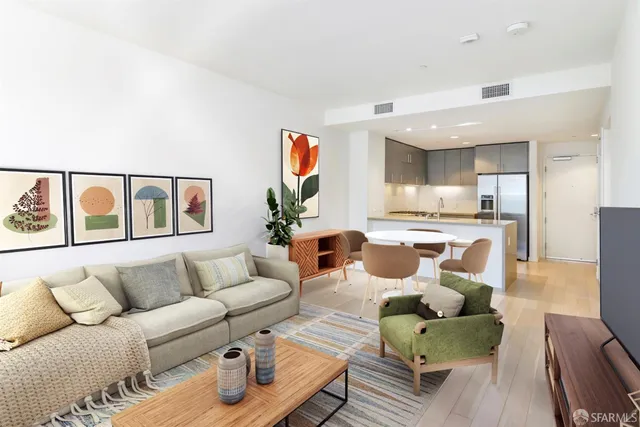 a living room with furniture a lamp and a window