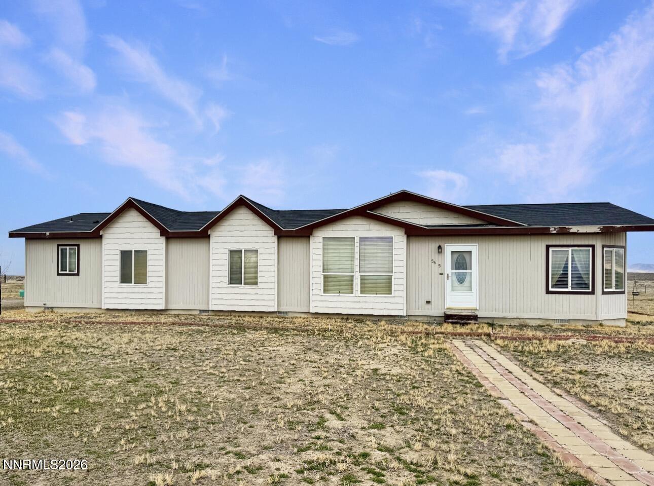 5695 Mote Road Battle Mountain, NV 89820 - Photo 1 of 16 a front view of a house with yard