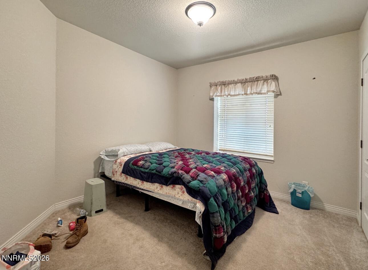 5695 Mote Road Battle Mountain, NV 89820 - Photo 16 of 16 a bedroom with a bed and window