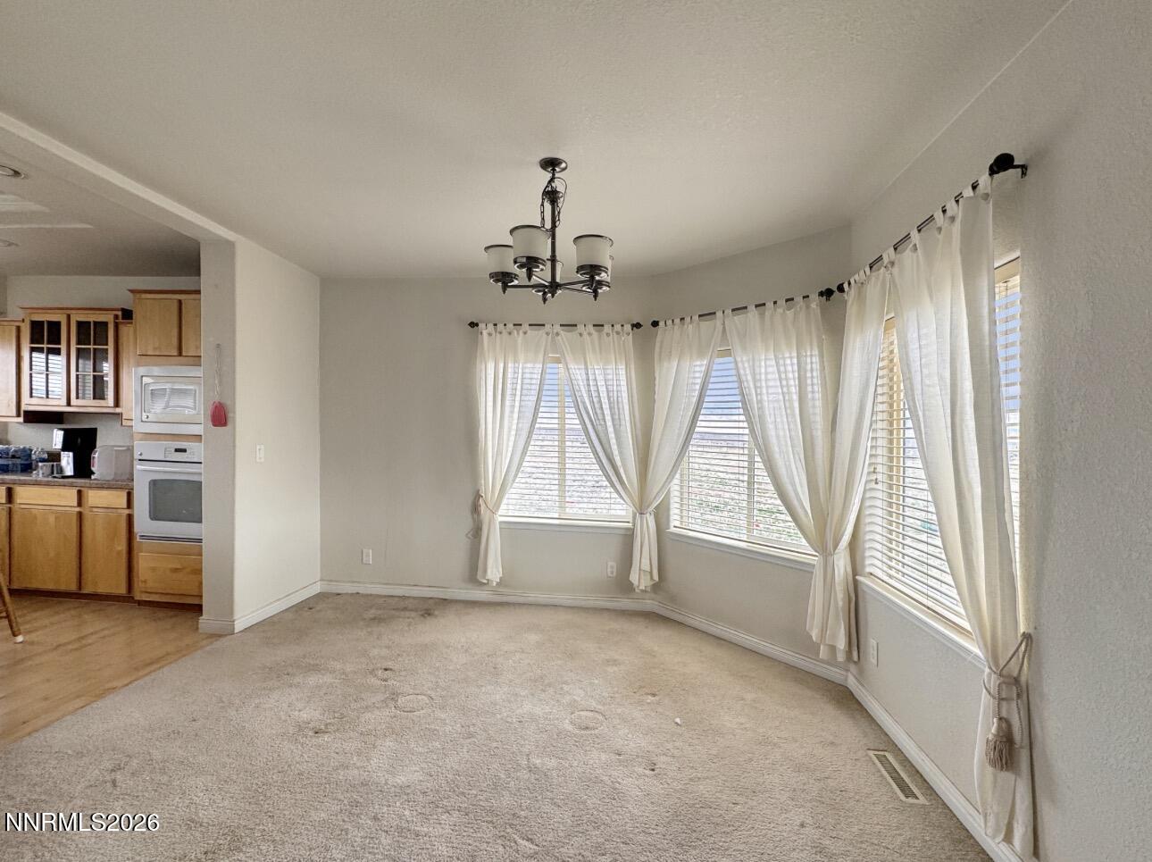 5695 Mote Road Battle Mountain, NV 89820 - Photo 9 of 16 wooden floor in an empty room with a window